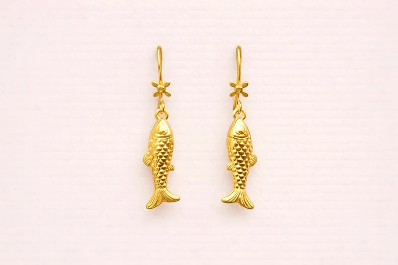 Boucles d’oreilles en acier inoxydable longueur 3,5 cm. Excellent état