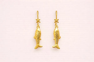 Boucles d’oreilles en acier inoxydable longueur 3,5 cm. Excellent état