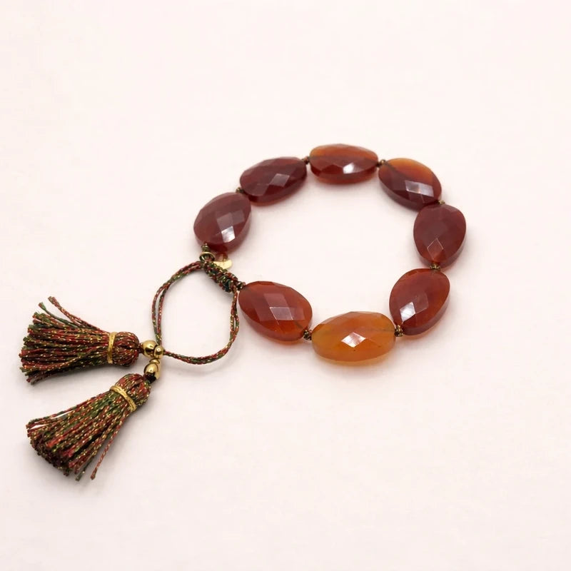Bracelet Habaha réglable en pierres naturelles  cornaline lien et pompons en lurex excellent état