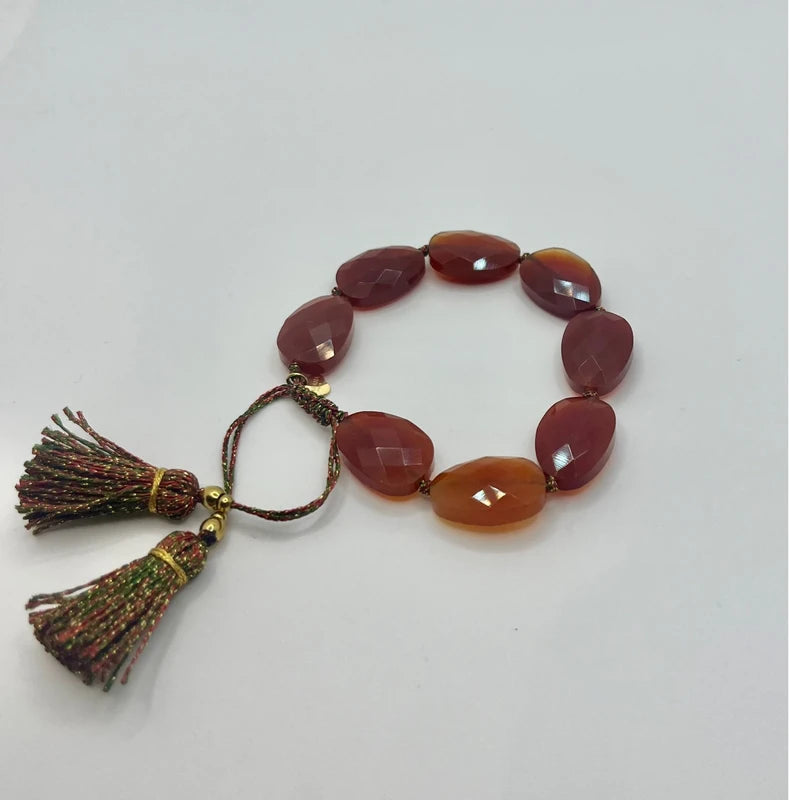 Bracelet Habaha réglable en pierres naturelles  cornaline lien et pompons en lurex excellent état